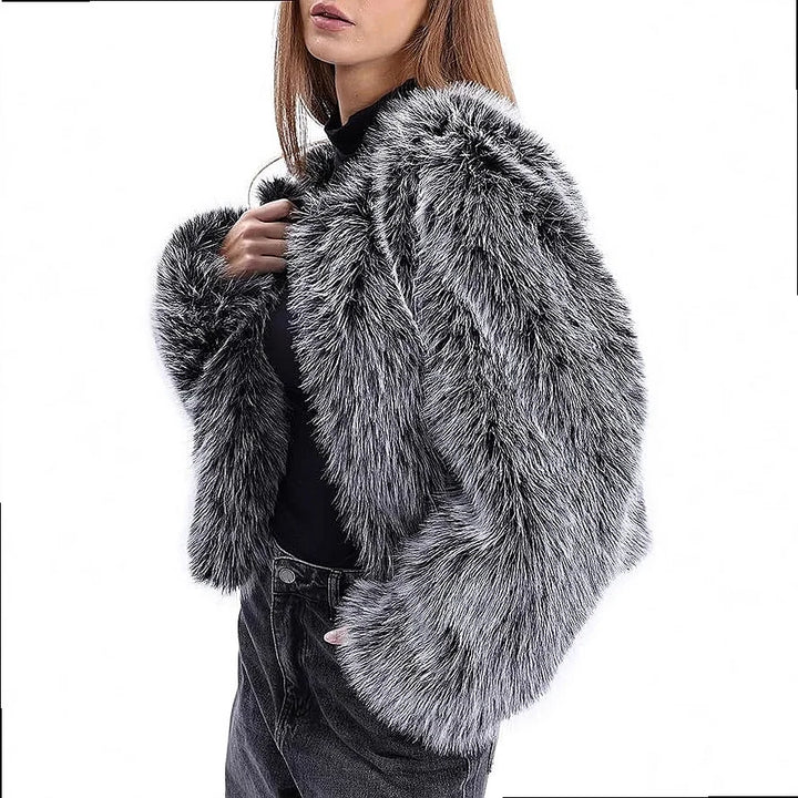 Side view of black and white faux fur cropped coat