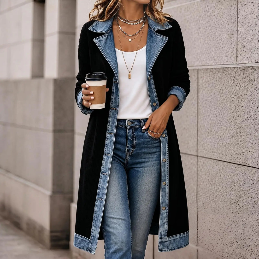 Woman wearing black ribbed knit long cardigan coat with denim lapel detail