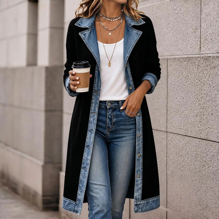 Woman wearing black ribbed knit long cardigan coat with denim lapel detail