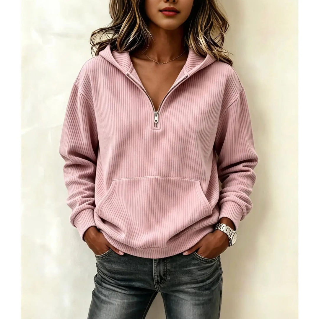 Woman wearing pink ribbed half-zip hoodie with kangaroo pocket