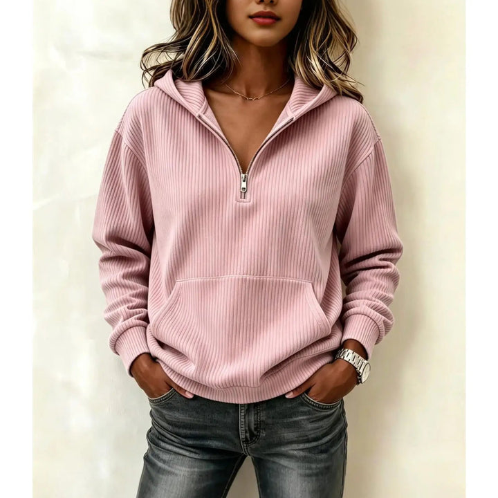 Woman wearing pink ribbed half-zip hoodie with kangaroo pocket