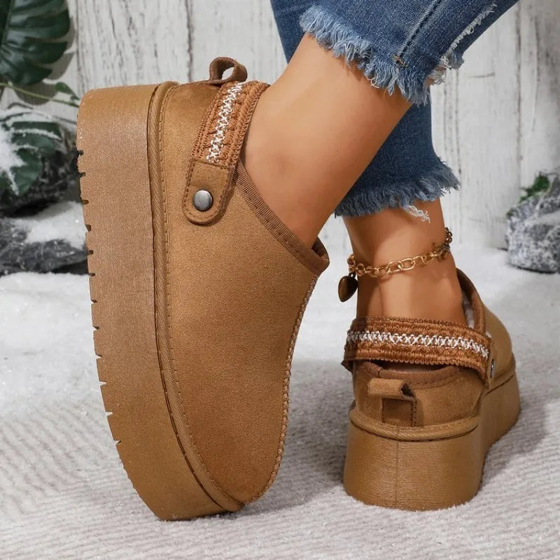 Back view of camel platform clog showing sling-back strap and woven trim