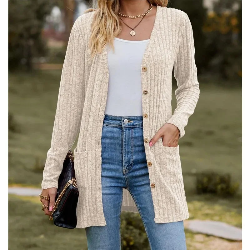 Woman wearing beige ribbed knit open front cardigan with pockets