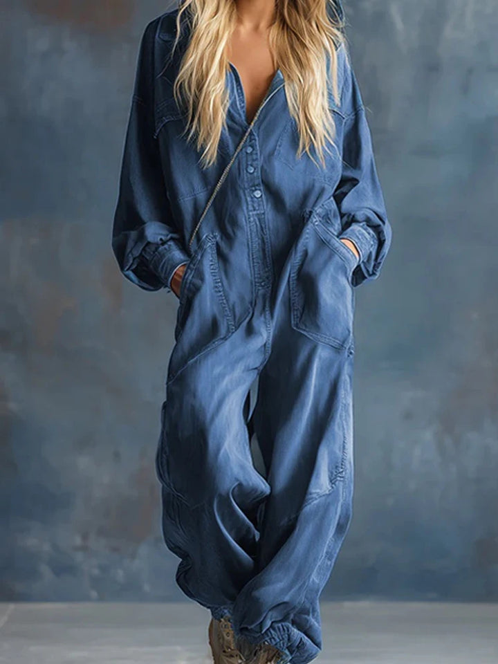 Woman wearing blue denim hooded jumpsuit, front view