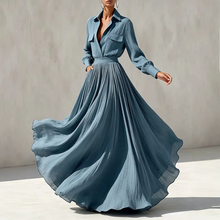 Close up of blue maxi shirt dress collar and flap pockets