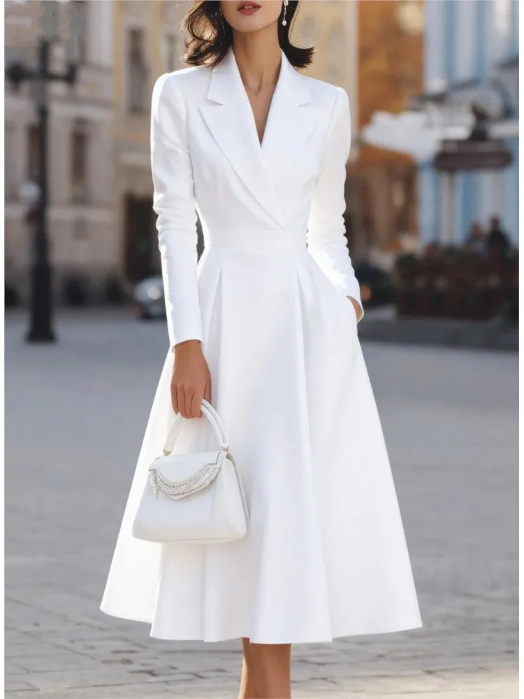 White maxi dress with pleated skirt, close view