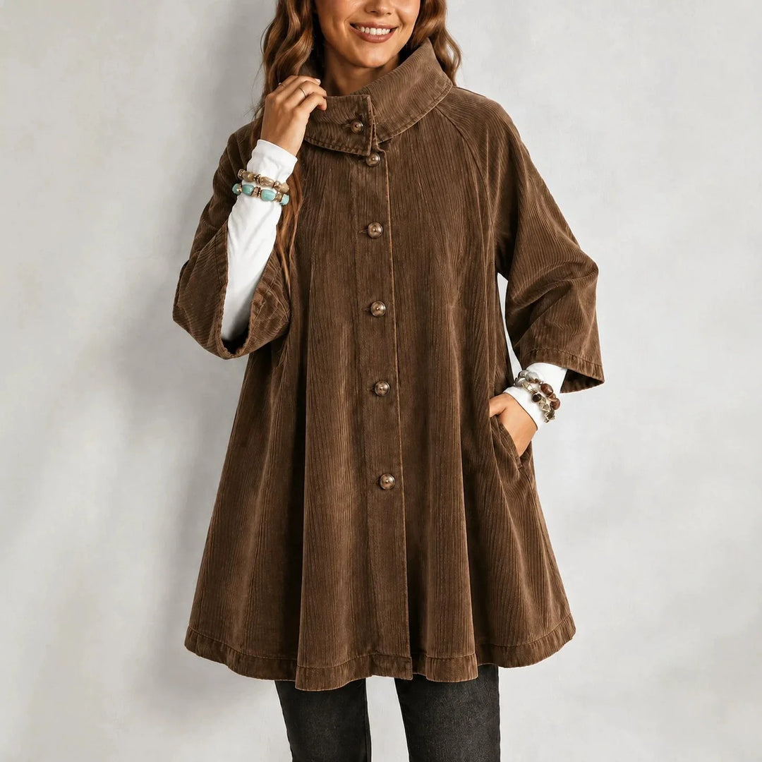 Woman wearing brown corduroy swing jacket with stand collar