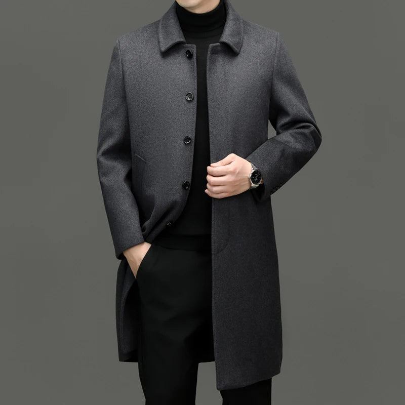 Man wearing grey wool coat, front view with hand in pocket