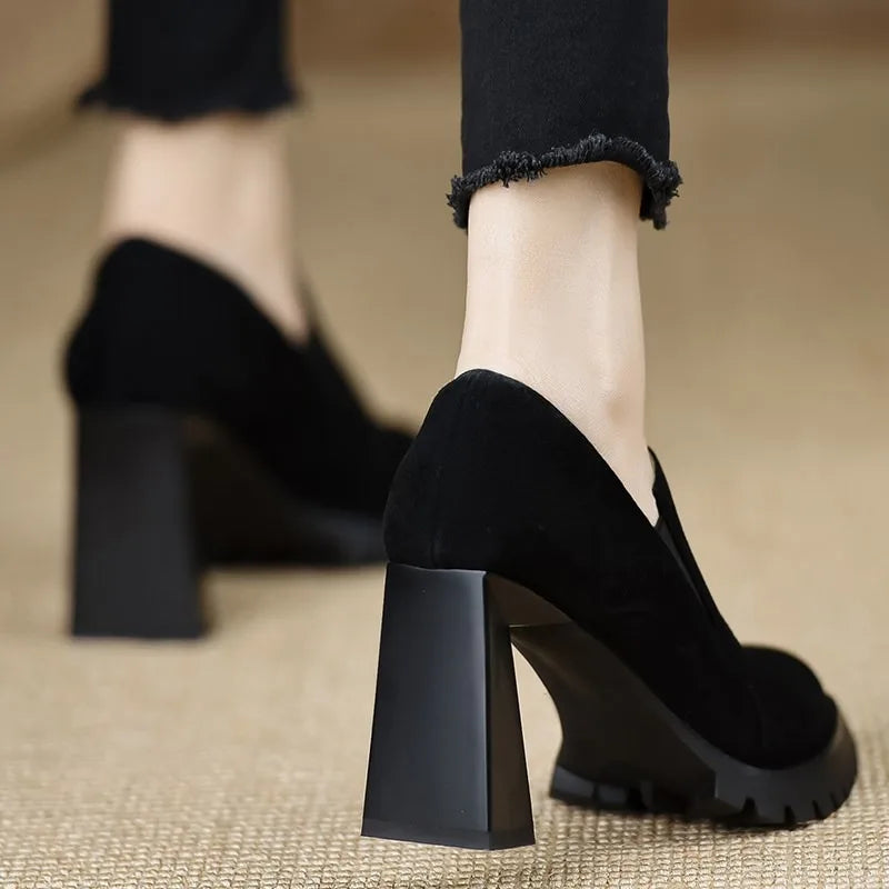 Black suede pointed toe pump, rear heel view