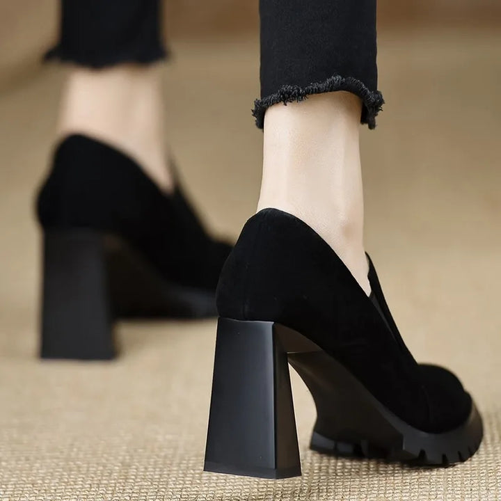 Black suede pointed toe pump, rear heel view