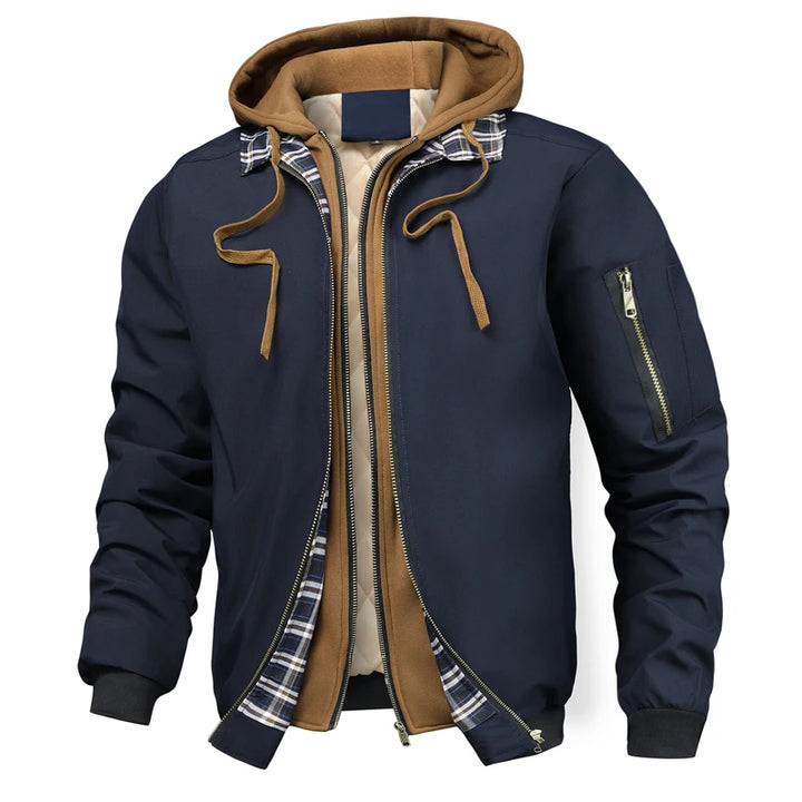 Navy blue hooded bomber jacket with tan hood and plaid trim, front view