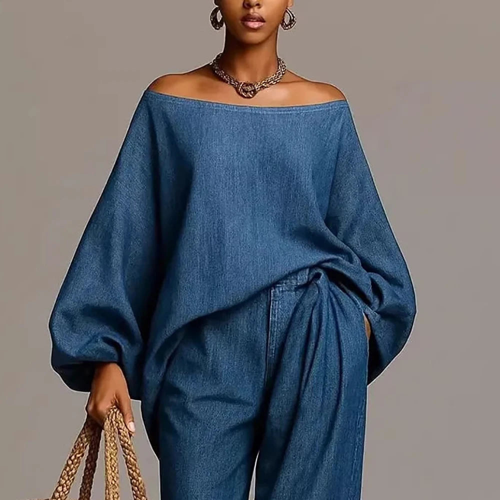 Woman wearing blue denim-look off shoulder balloon sleeve top and wide leg pants set, front close up