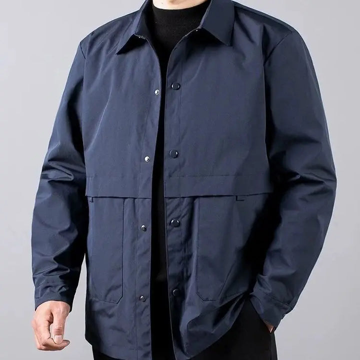 Man wearing navy blue shirt jacket, close front view