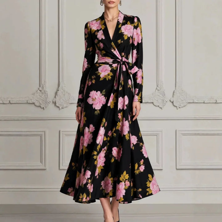 Woman wearing black floral wrap dress with tie waist, front view