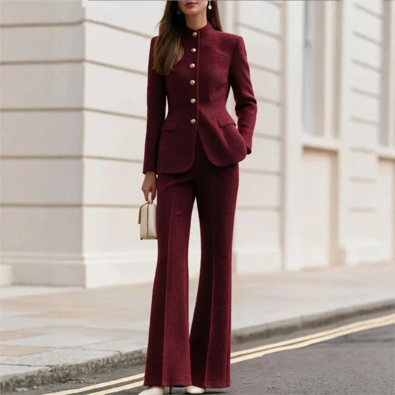 Woman wearing claret tweed stand collar blazer and flared trousers set