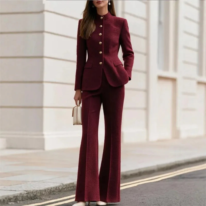 Woman wearing claret tweed stand collar blazer and flared trousers set