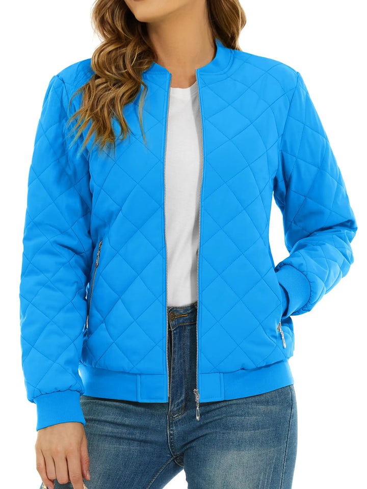 Close up of azure blue quilted bomber jacket with zip pocket