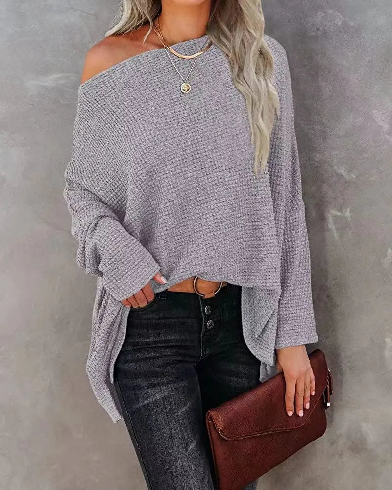 Grey waffle knit off-shoulder sweater on model