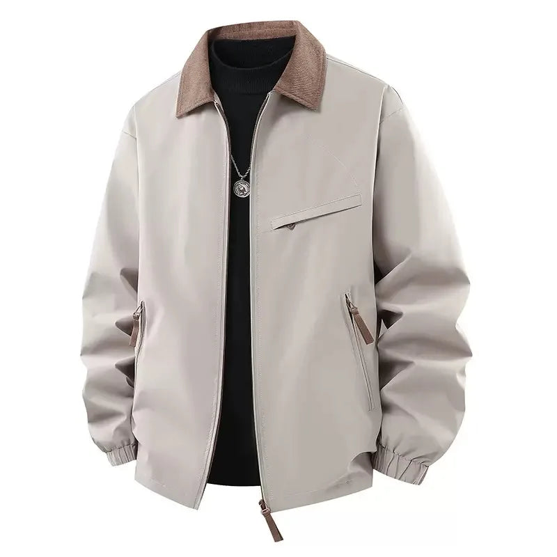 Beige jacket worn open over black sweater