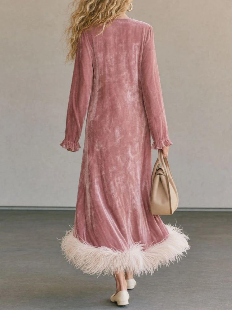 Pink velvet maxi dress with feather trim hem, back view