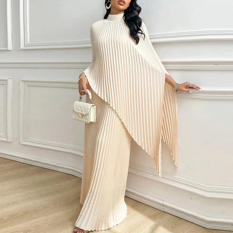 Woman wearing apricot pleated cape top and wide leg pants two piece set