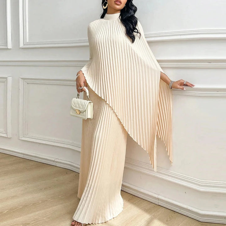 Woman wearing apricot pleated cape top and wide leg pants two piece set