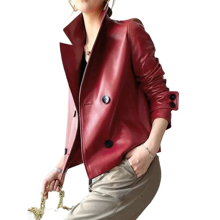 Model wearing red faux leather cropped jacket, front angled view