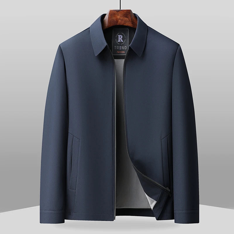 Navy blue zip-front jacket on hanger, front view