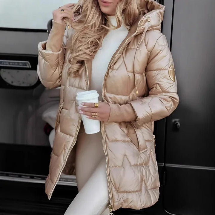 Woman wearing champagne quilted mid length puffer jacket with hood
