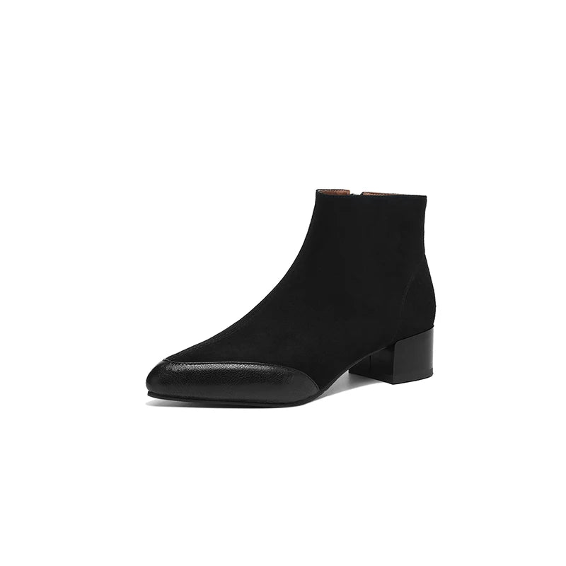 Black suede ankle boot with contrast leather toe cap on white background