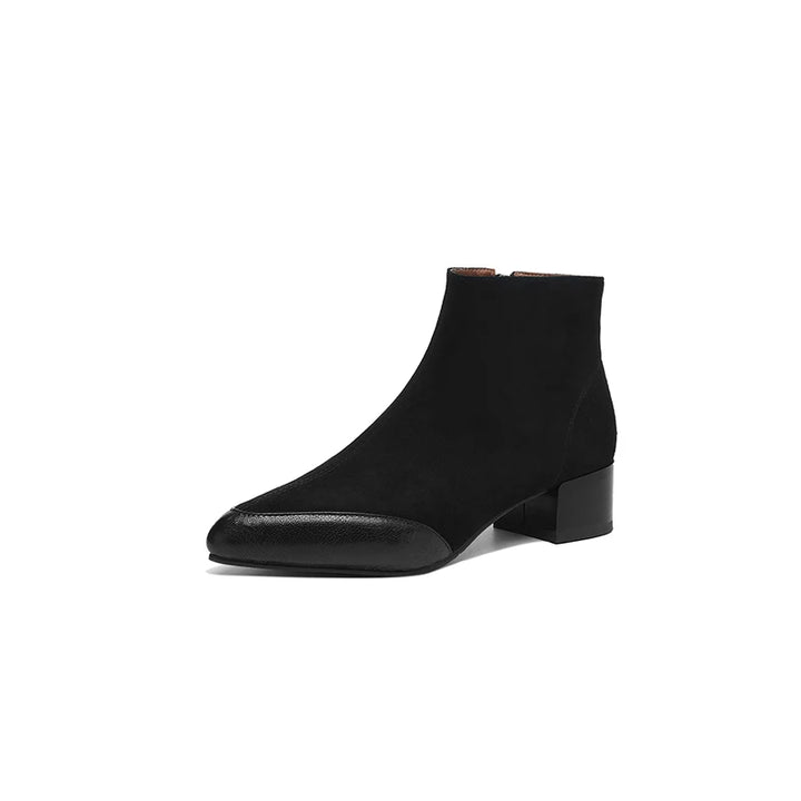 Black suede ankle boot with contrast leather toe cap on white background