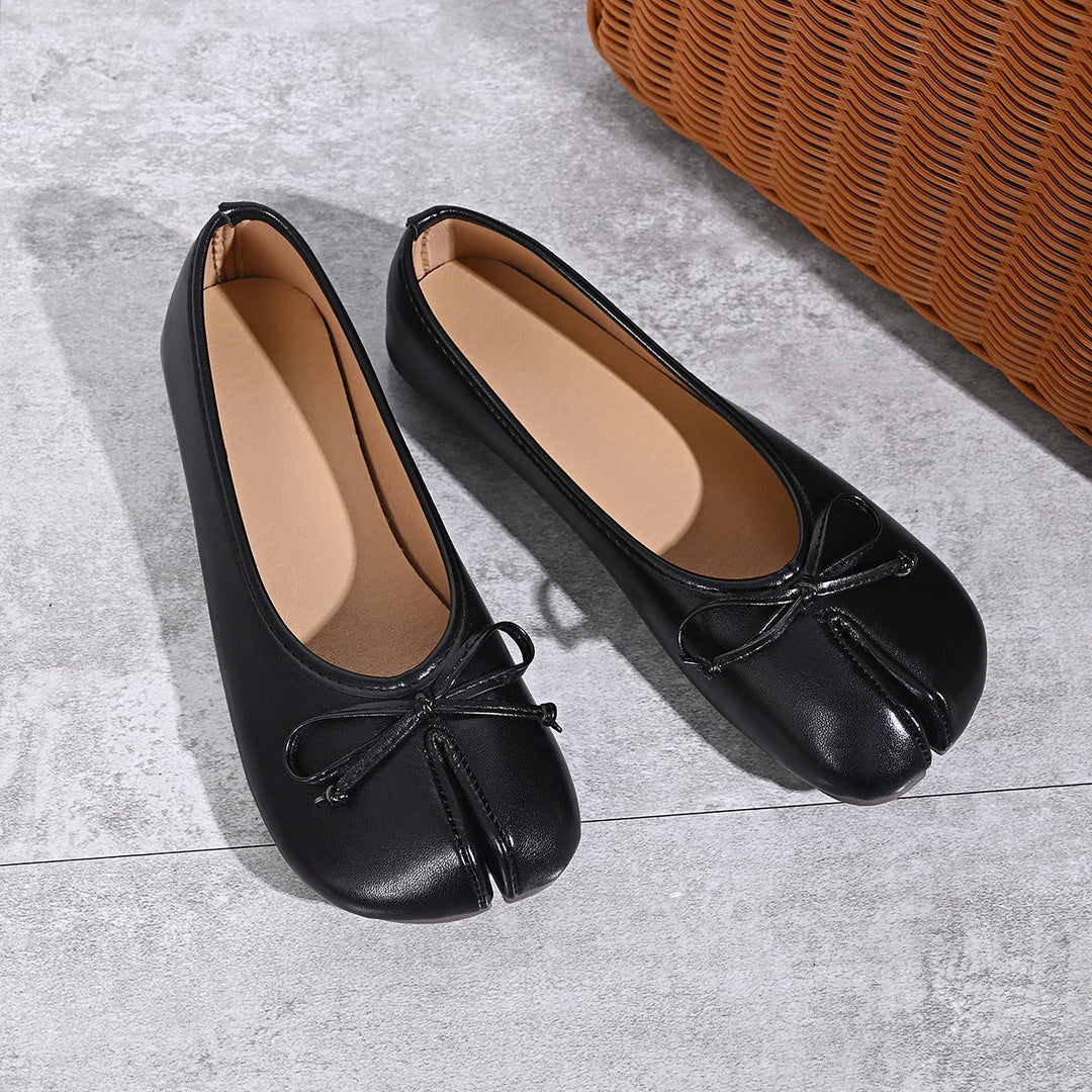 Black faux leather tabi ballet flats angled view