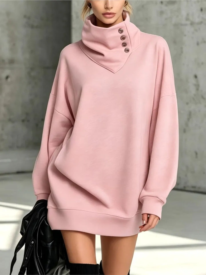 Pink sweatshirt dress with buttoned collar, close up view