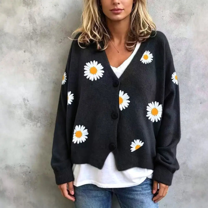 Woman wearing black daisy embroidered cardigan