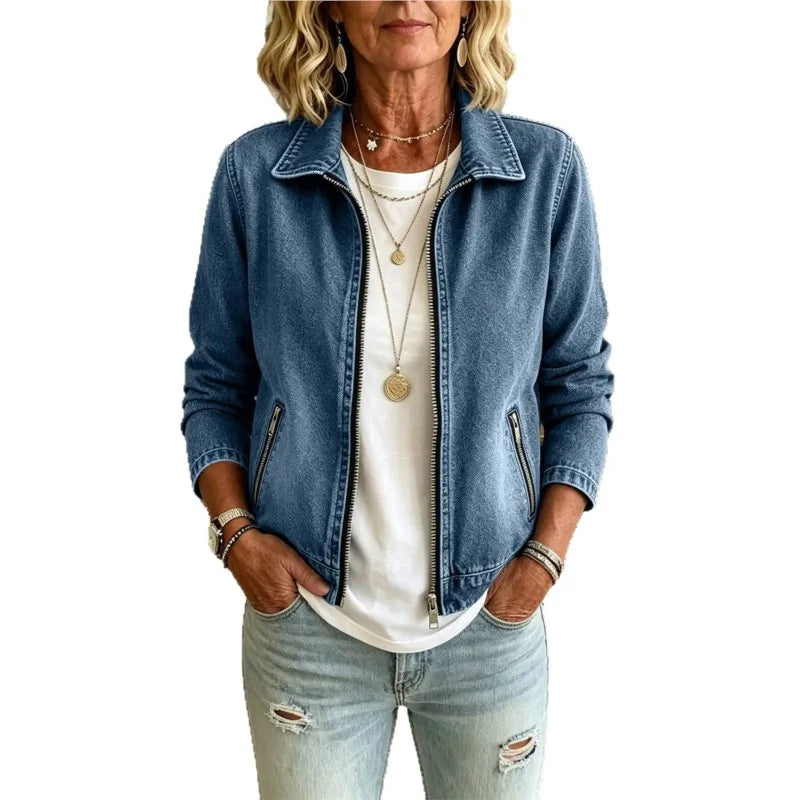 Close up front view of blue denim jacket with zip pockets