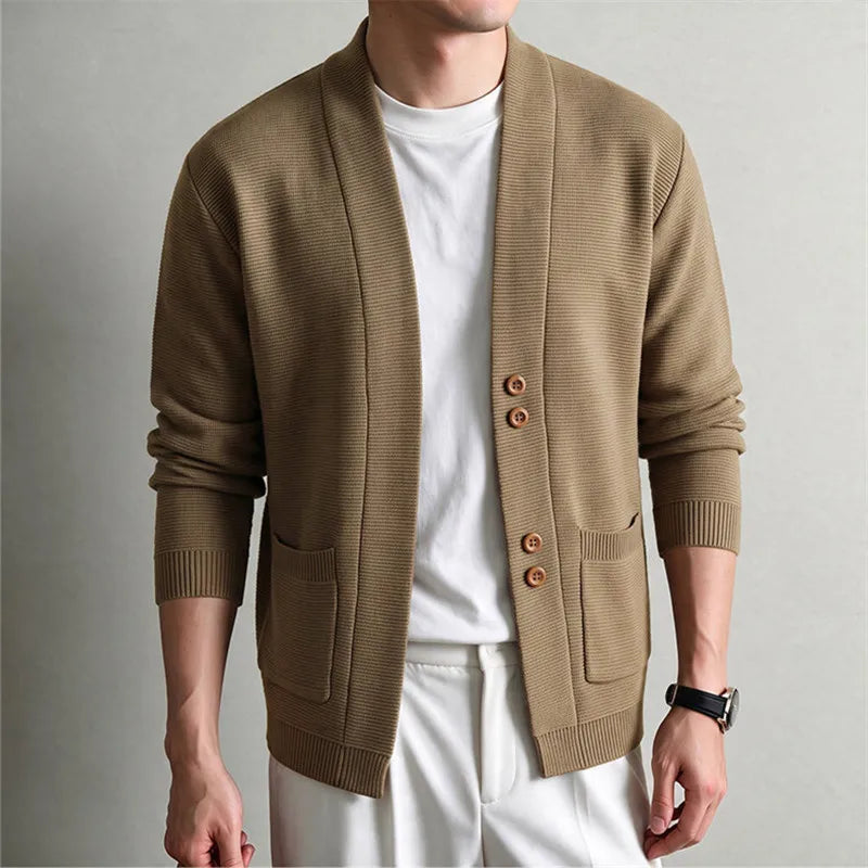 Man wearing khaki knit shawl collar cardigan with patch pockets