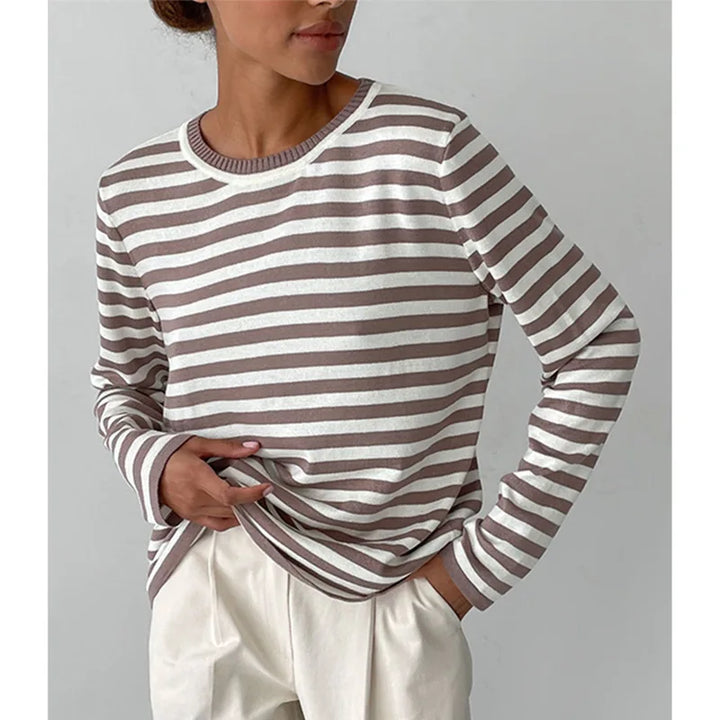 Woman wearing brown and white striped knit sweater