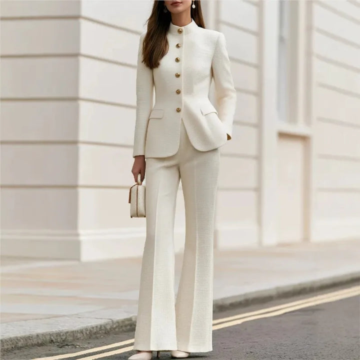 Woman wearing beige tweed stand collar blazer and flared trousers set