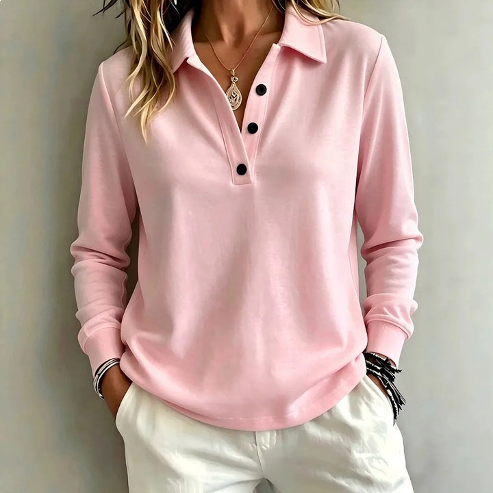 Pink long sleeve polo shirt with button placket, close-up