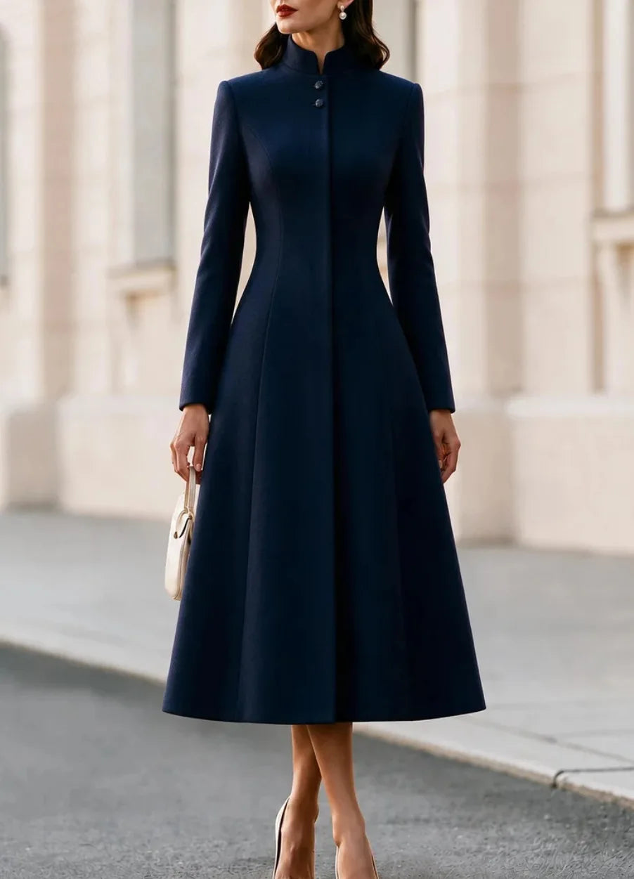 Woman wearing navy blue stand collar coat dress, close up front view