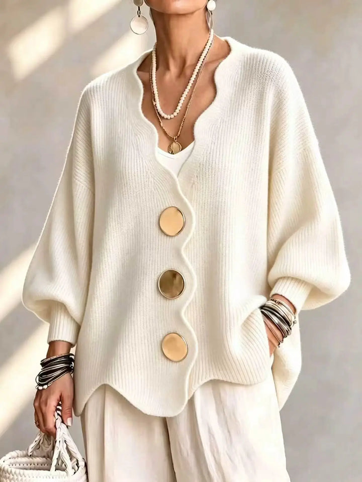 Beige oversized cardigan with curved hem