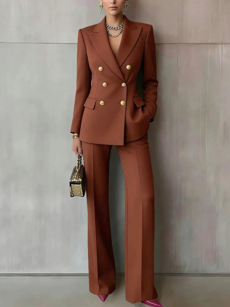 Woman wearing brown double breasted pantsuit with wide leg trousers