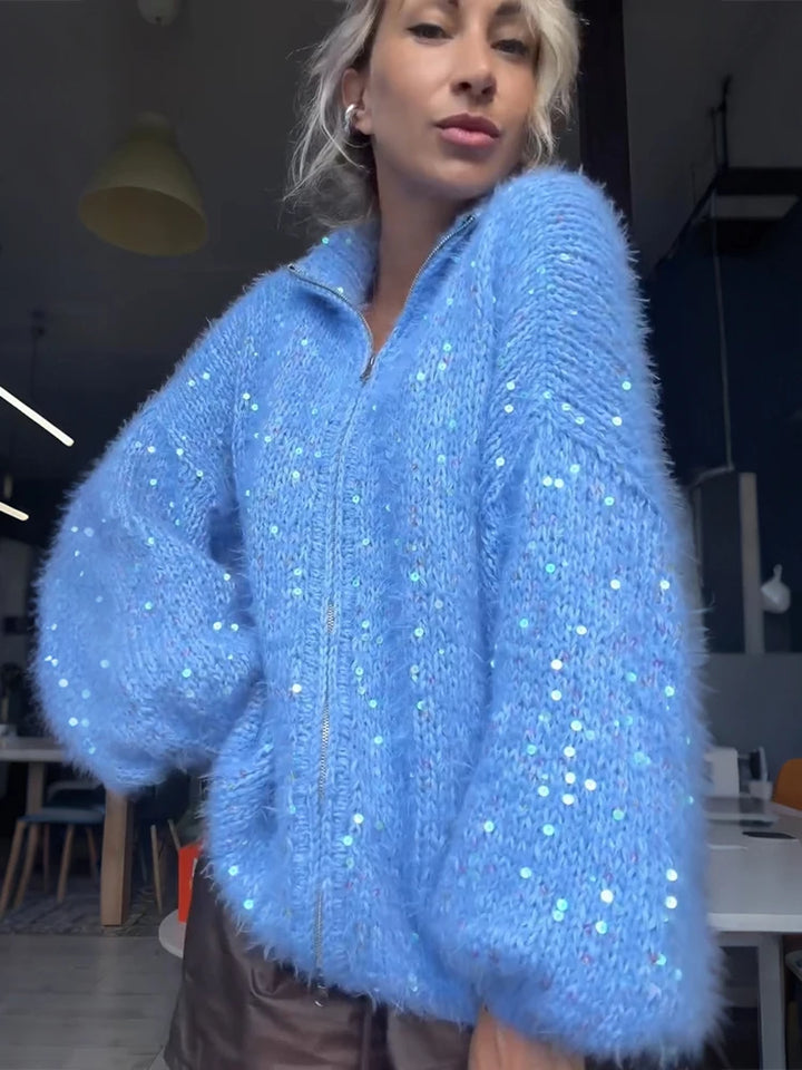 Side view of blue fuzzy sequin knit cardigan with stand collar
