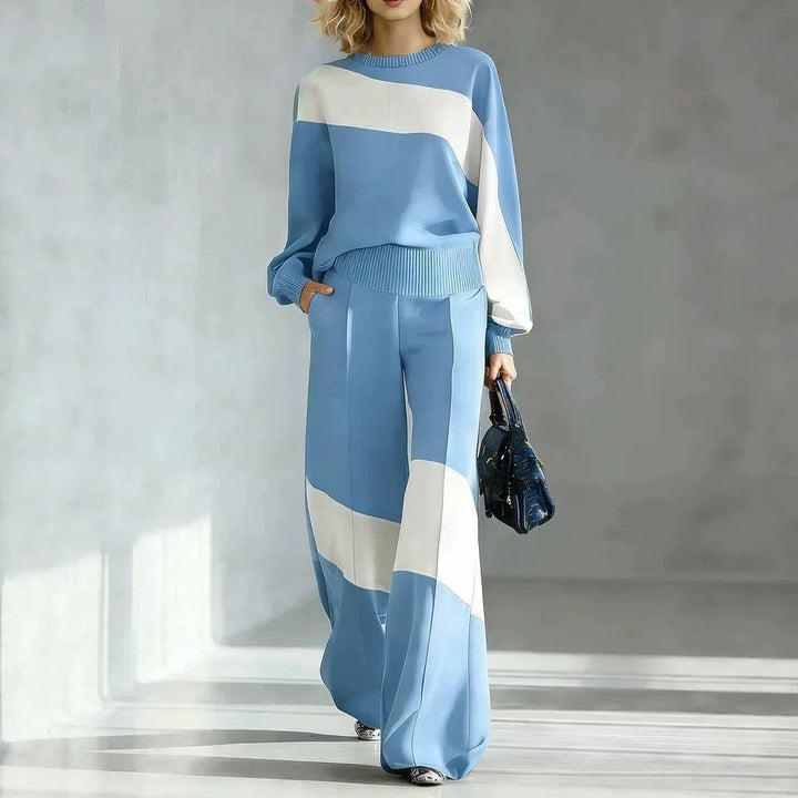 Woman wearing blue color block sweater and wide leg pants set