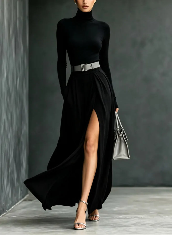 Woman wearing black turtleneck sweater dress with high slit
