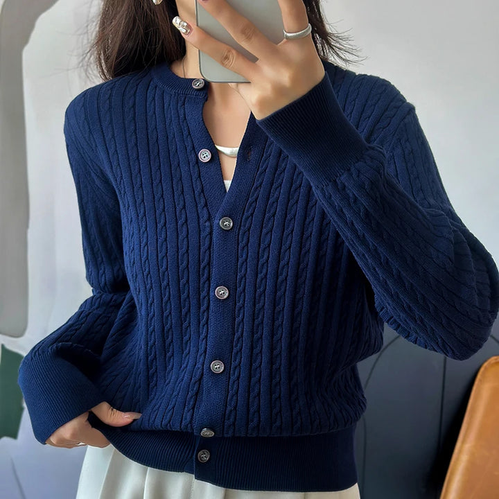 Navy blue cable knit cardigan close up buttons