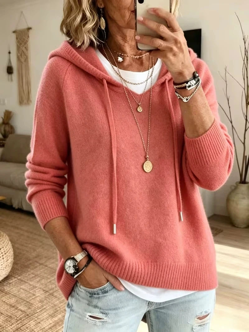 Close up of pink knit drawstring hoodie front with hood and drawstrings