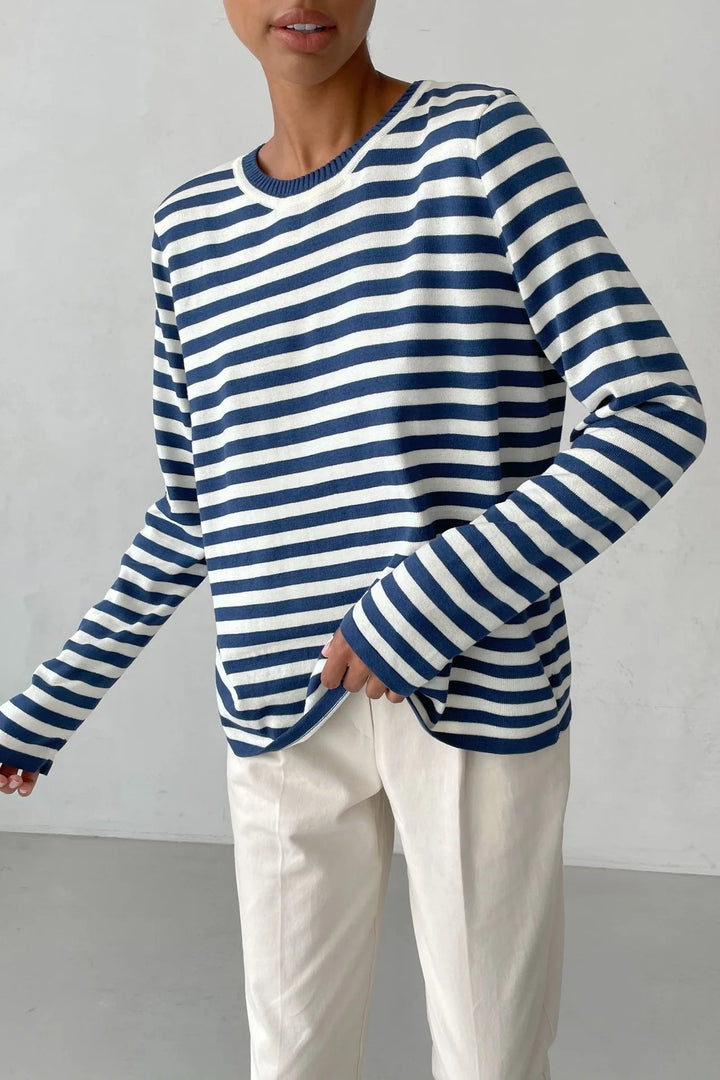 Woman wearing navy and white striped knit sweater close up