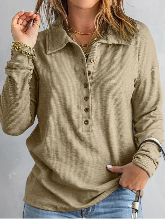 Woman wearing khaki ribbed knit henley top with button placket and turn-down collar
