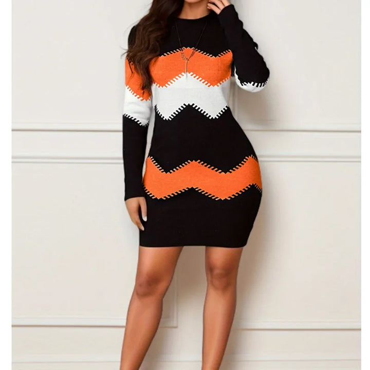 Black sweater dress with orange and white chevron stripes, full length front view